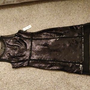 Brand new sequined dress with sheer top, buttom,below the knee,40 inches long.